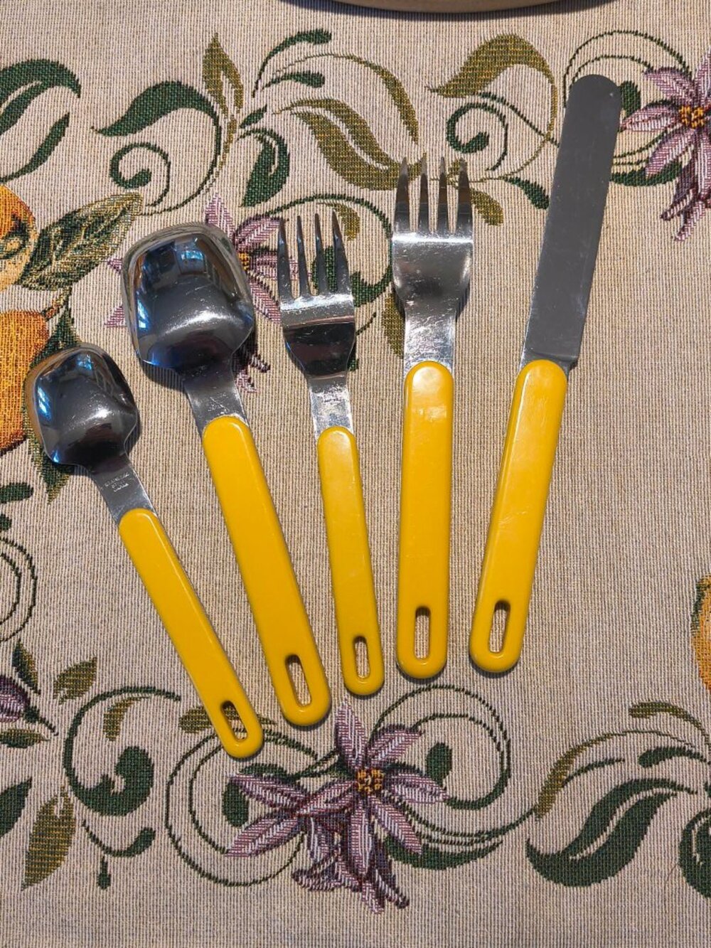 Vintage yellow and stainless steel flatware